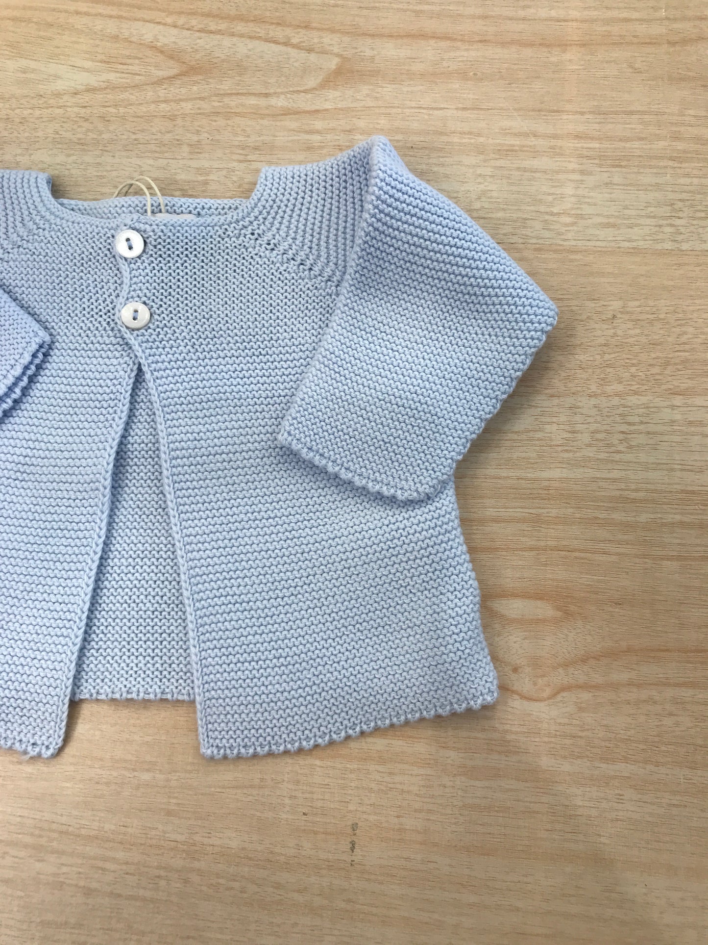 Cardigan PCS in filo celeste con due bottoncini