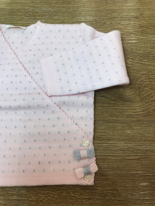 Cardigan Baby Lord in lana rosa ad incrocio con pois grigi e piccoli fiocchetti laterali