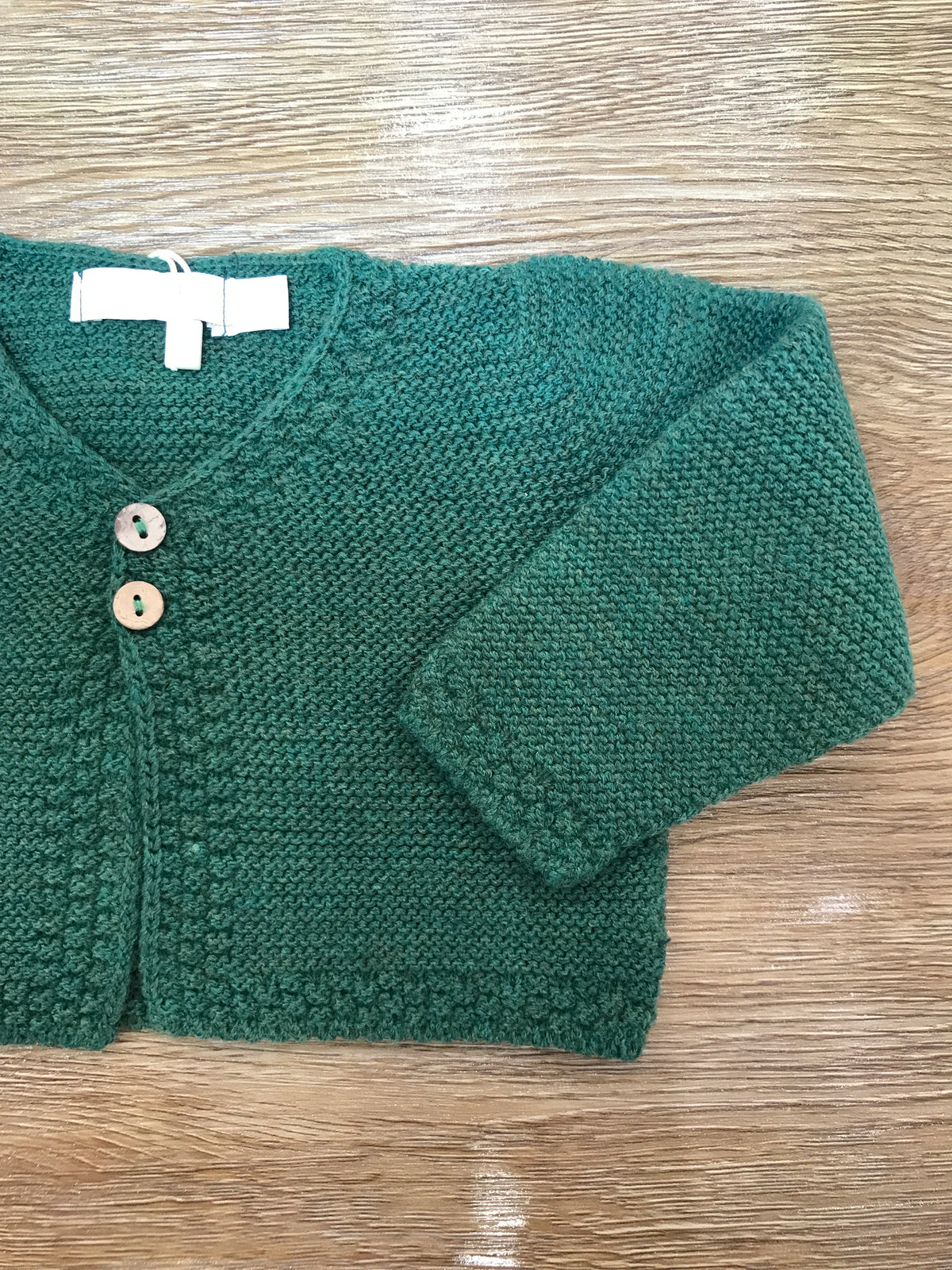 Cardigan PCS in acrilico verde con due piccoli bottoncini