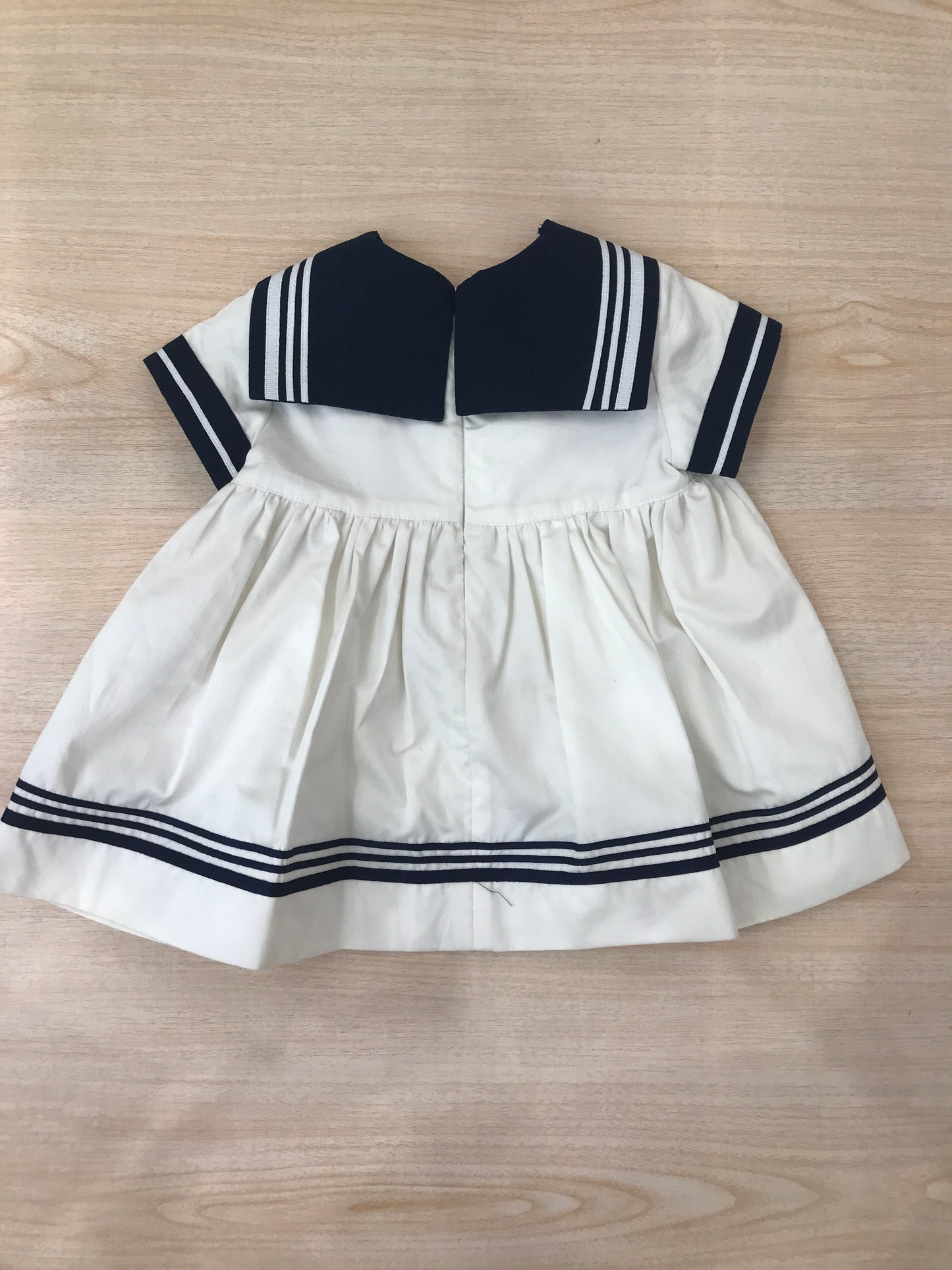Abito Cielo Blu in cotone bianco e blu a righe stile marinaretto con fiocchetto sul davanti