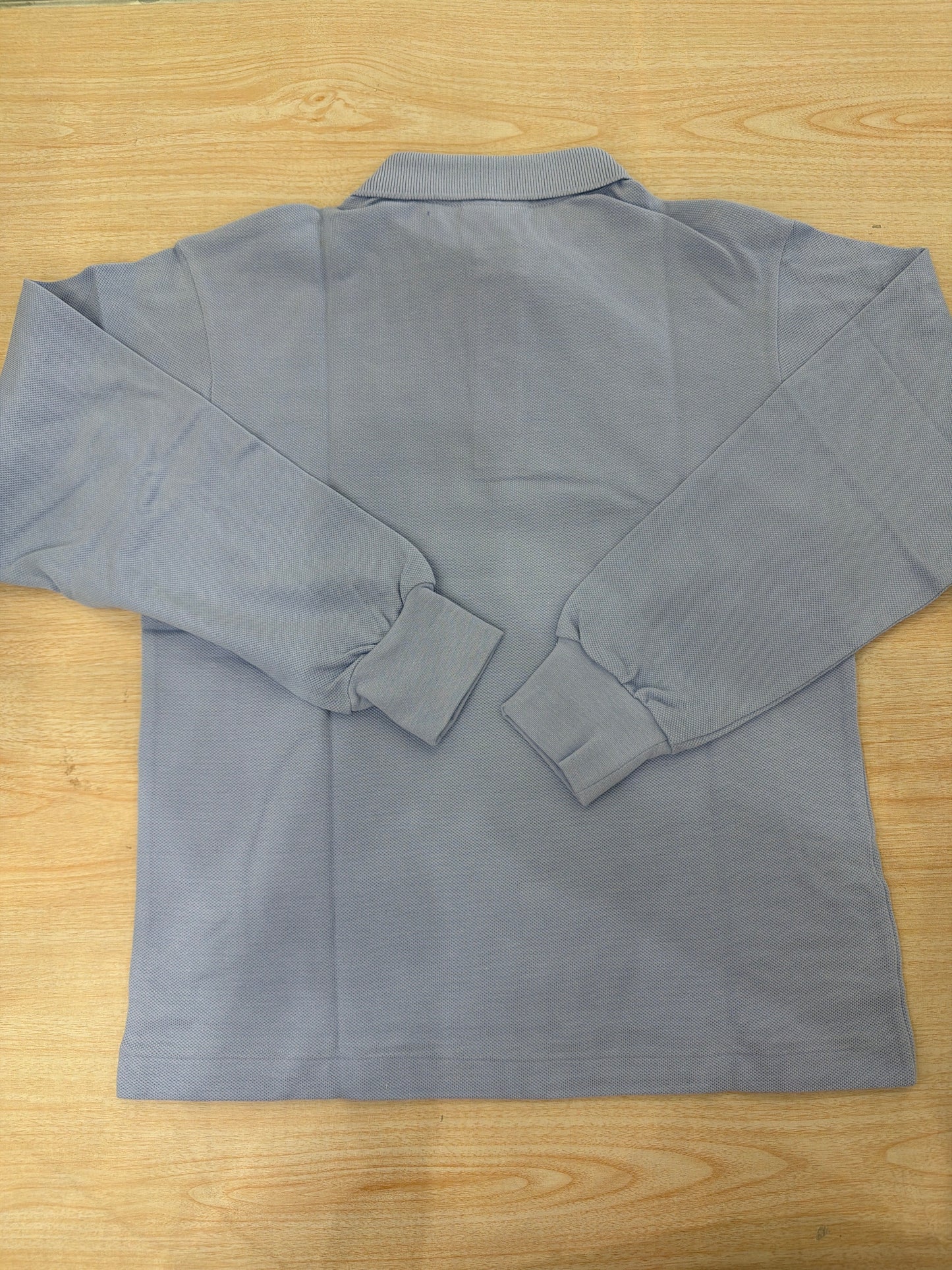 Polo Lacoste in cotone manica lunga con bottoncini e logo ricamato lateralmente unisex