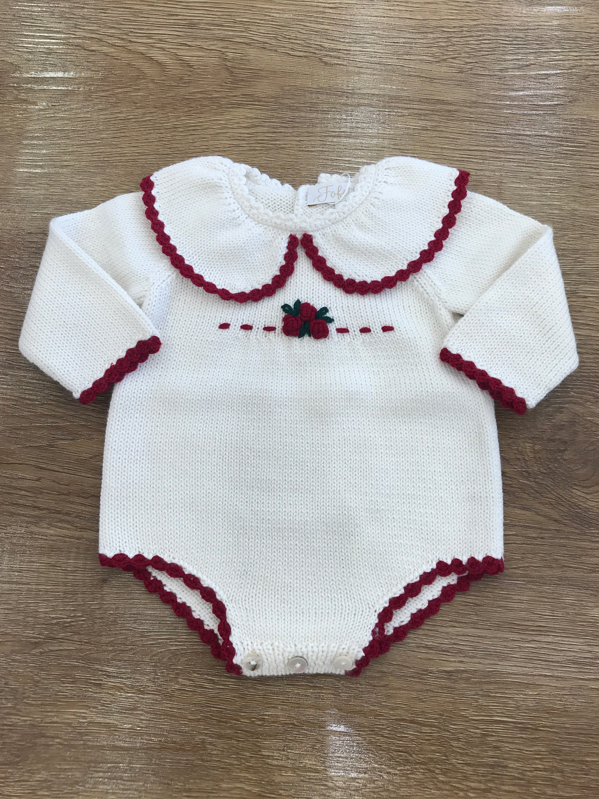 Pagliaccetto Fofettes in lana con rifiniture in rosso e ricamo di rose sul corpetto centrali