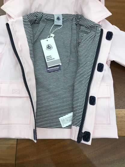 Giubbotto Impermeabile Petit Bateau rosa con cappuccio con zip e strappo e tasche sul davanti