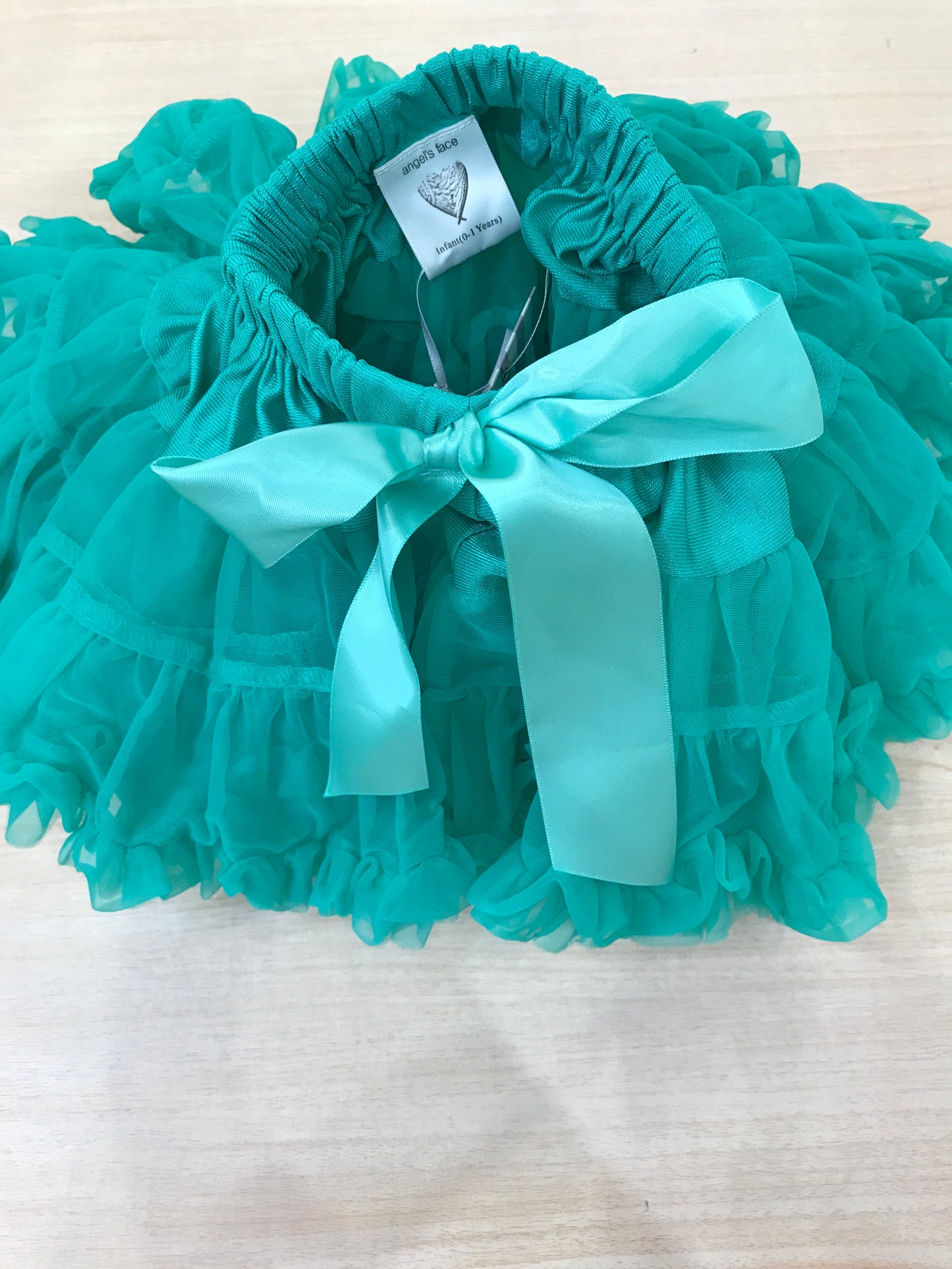 Gonna Angel's face in tulle verde con doppie balze e fiocco sul davanti