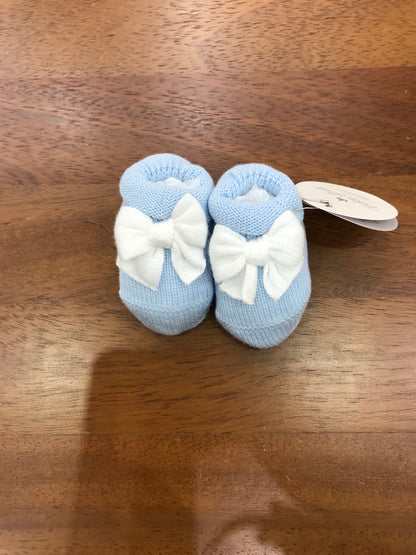 Babbucce Baby Lord in filo celesti con risvolto con fiocco bianco sul davanti