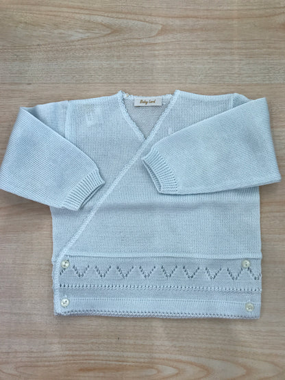 Cardigan Baby Lord in filo celeste chiaro ad incrocio con lavorazioni in basso