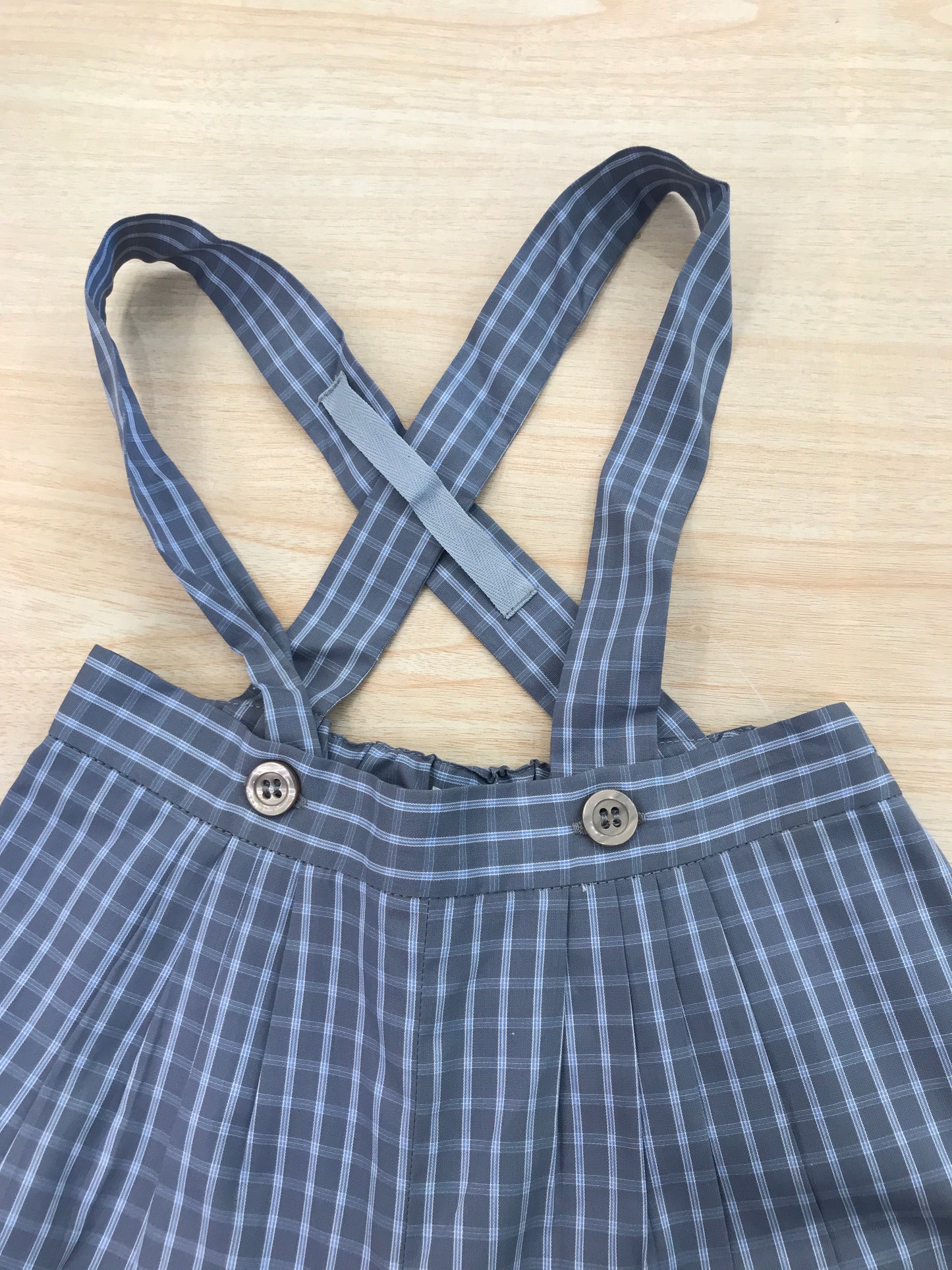 Pantalone Bonpoint in cotone a sbuffo con bretelle fantasia a quadretti