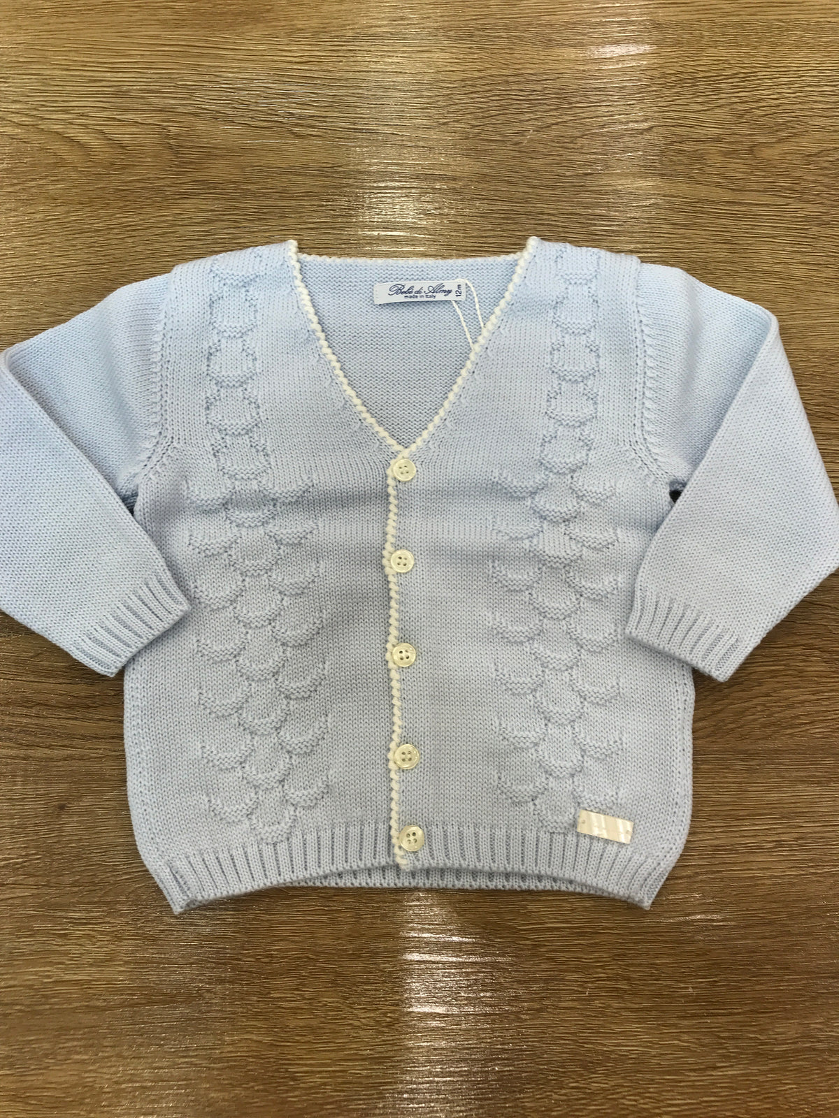 Cardigan Bebè di Almy in lana celeste con lavorazione sul davanti piccoli bottoncini e punto gambero sul davanti