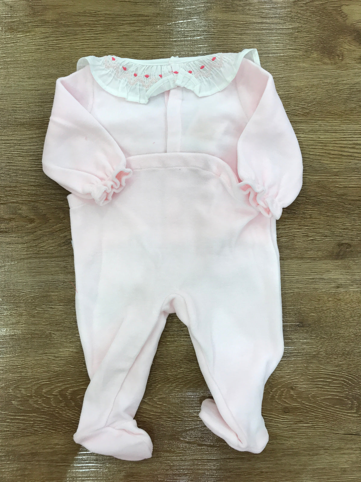 Tutina Petit Bateau in ciniglia rosa intera con collo con rusche e pois