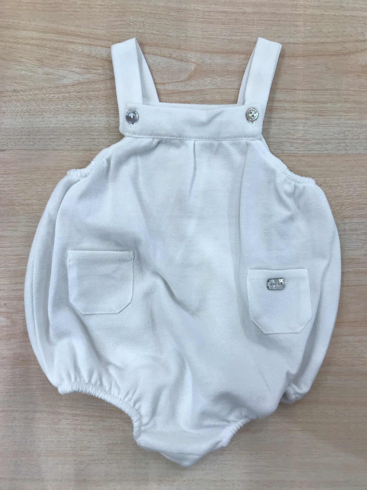 Salopette Nanan in cotone con bretelle bianca con tasche sul davanti