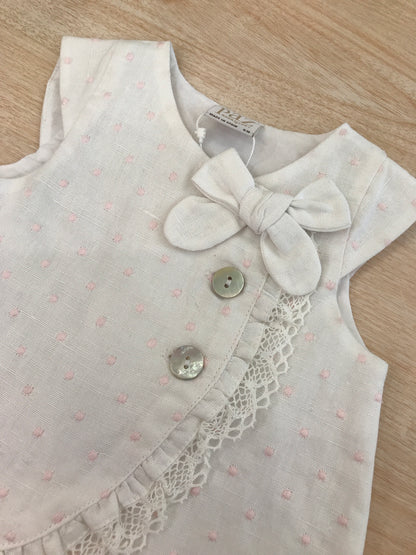 Abito Paz Rodriguez in cotone smanicato con pois rosa con rusche e bottoni trasversali con fiocco