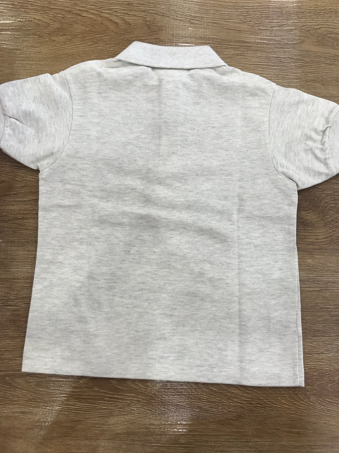 Polo Lacoste mezza manica con polsini e bottoncini