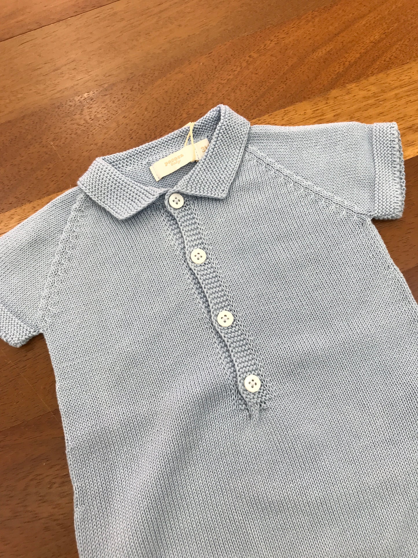 Pagliaccetto PCS in filo celeste mezza manica con collo a punta con bottoncini