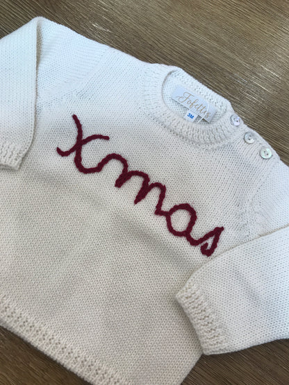 Maglione Fofettes panna con piccoli bottoncini e ricamo rosso sul davanti "xmas"