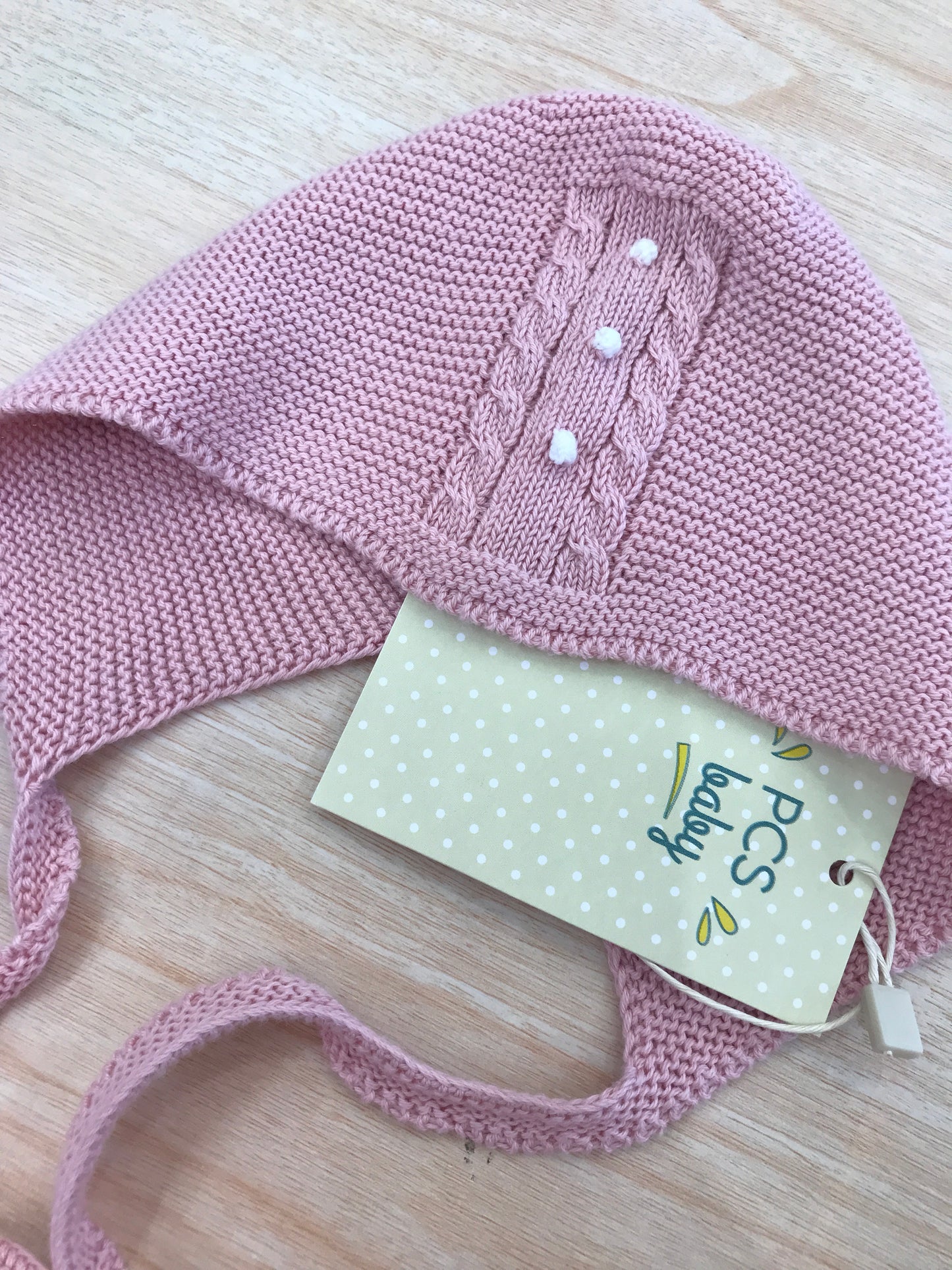 Cuffia PCS in filo rosa con pois in rilievo bianchi e trecce