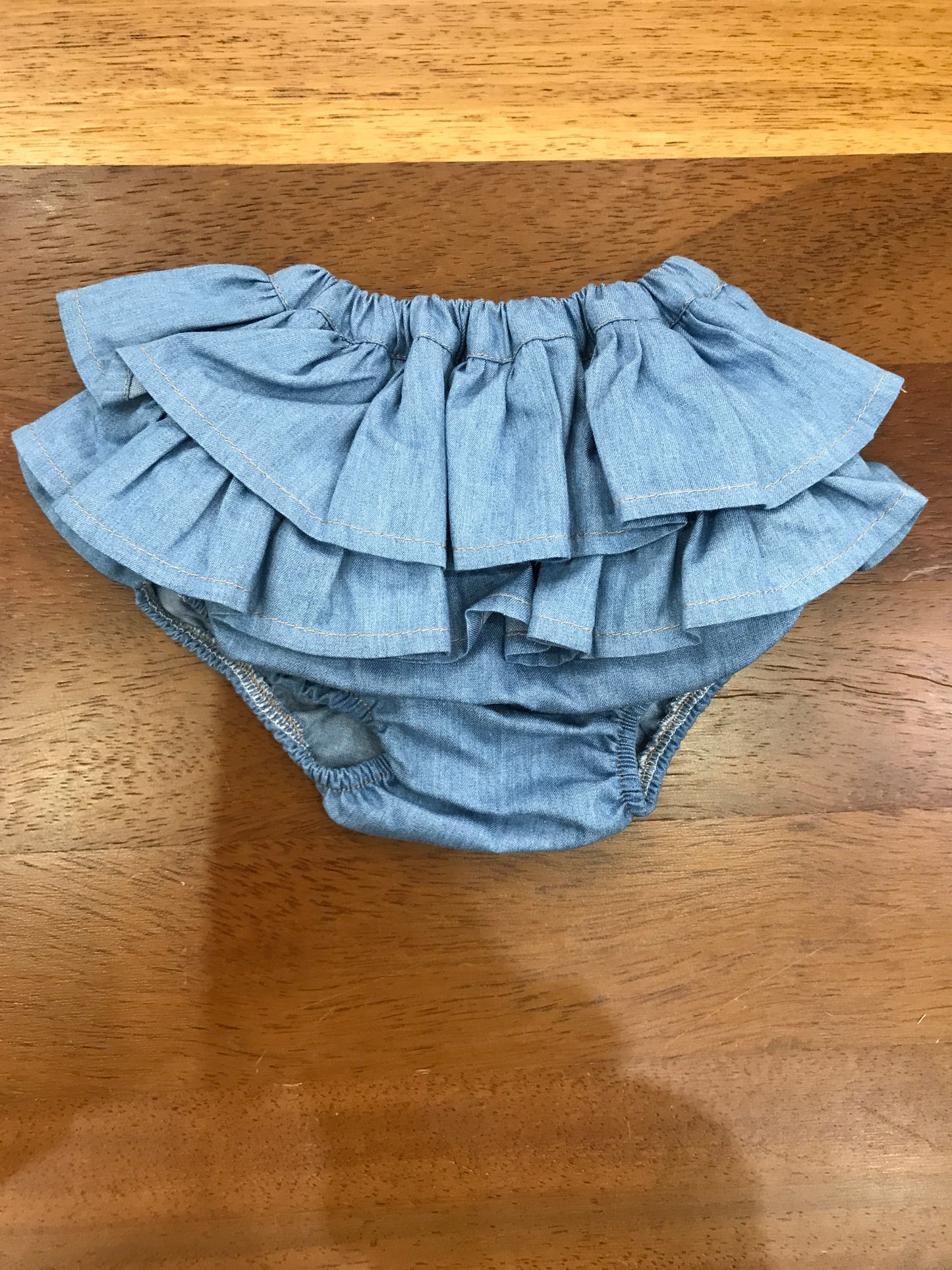 Culotte Baby Gi in cotone color denim con due strati di rusche