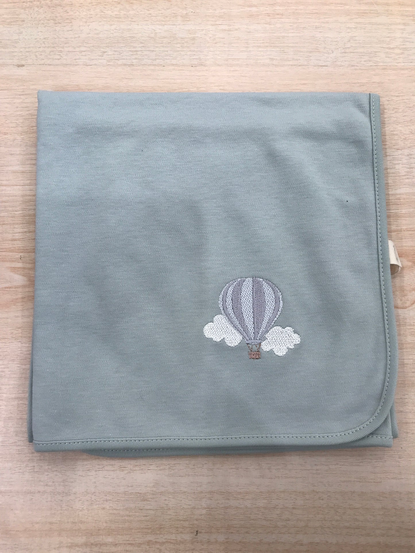 Mussola Baby Gi in cotone verde menta con mongolfiera