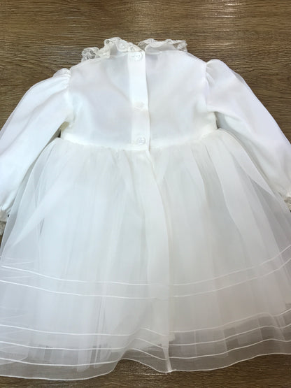 Abito Piccola Giuggiola in organza in seta manica lunga con polsini con valancienne gonna con pieghe in basso corpetto finemente lavorato con piccole roselline e arricchito da valancienne