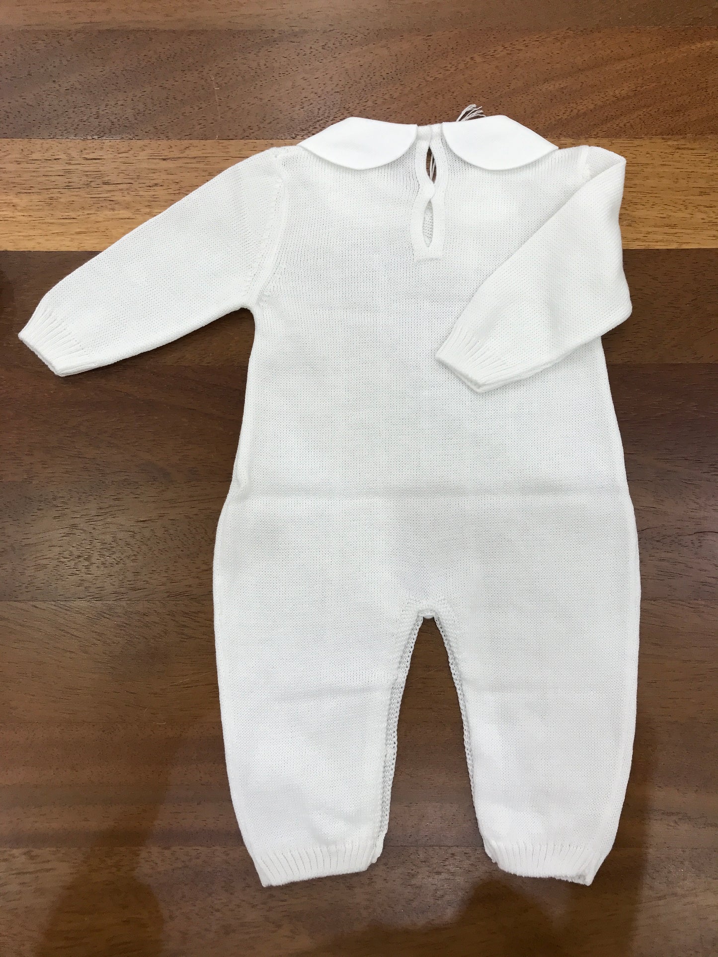 Tutina Baby Lord in filo bianca manica lunga con lavorazione di trecce con collo tondo