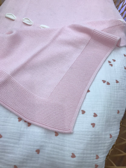 Coperta Baby Lord in lana rosa con passanastro panna e fiocco con roselline ricamate