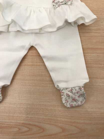 Tutina Baby Gi in cotone due pezzi manica lunga con piedini decorati da fiorellini rusche colletto con fiorellini e fiocchetto laterale in basso