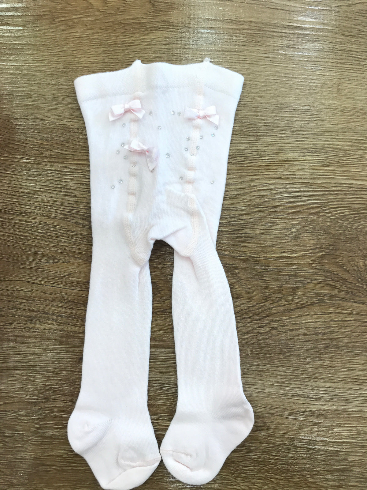 Calze Story Loris in rosa chiaro con brillantini e fiocchetto sul retro