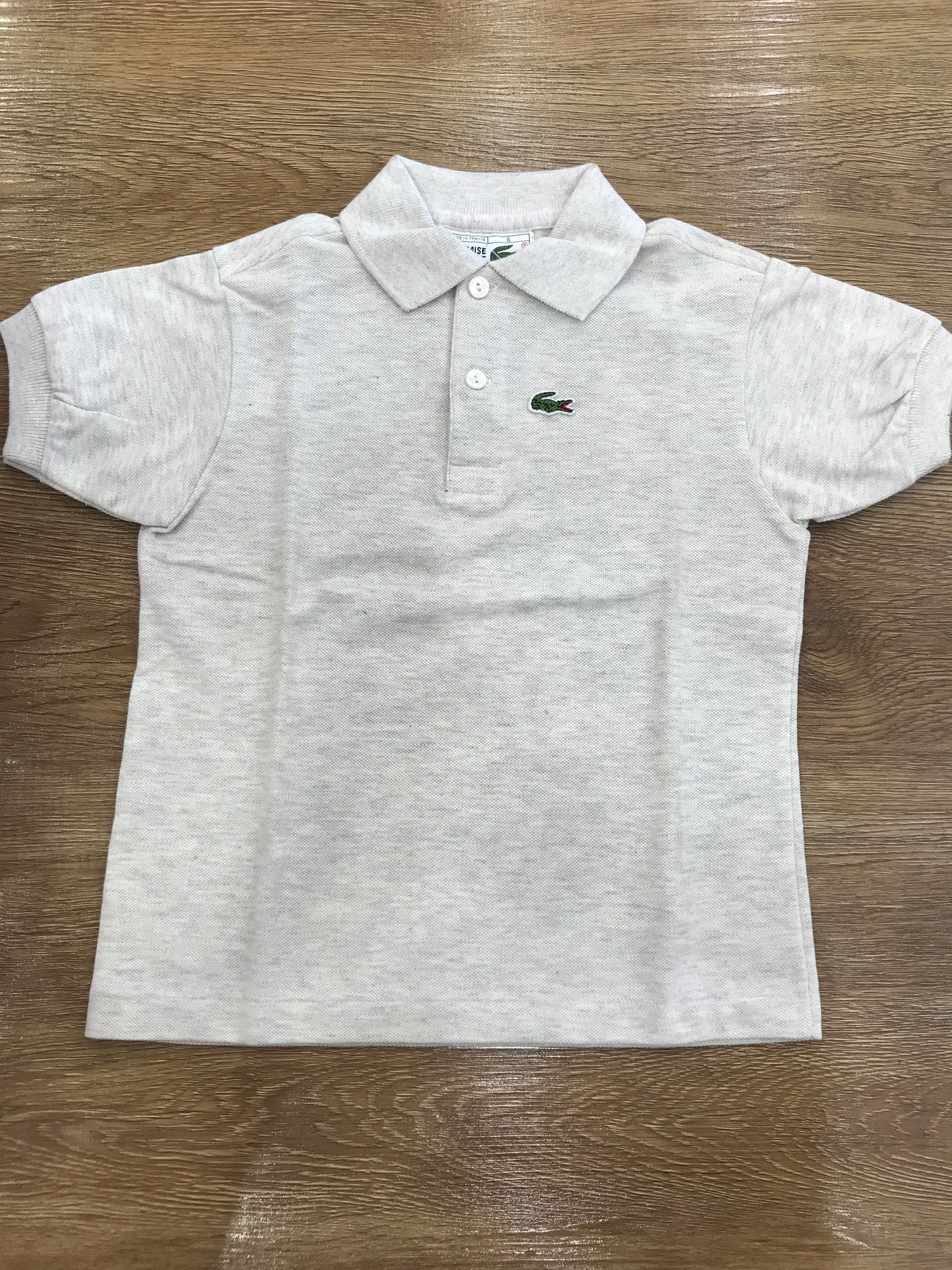 Polo Lacoste mezza manica con polsini e bottoncini