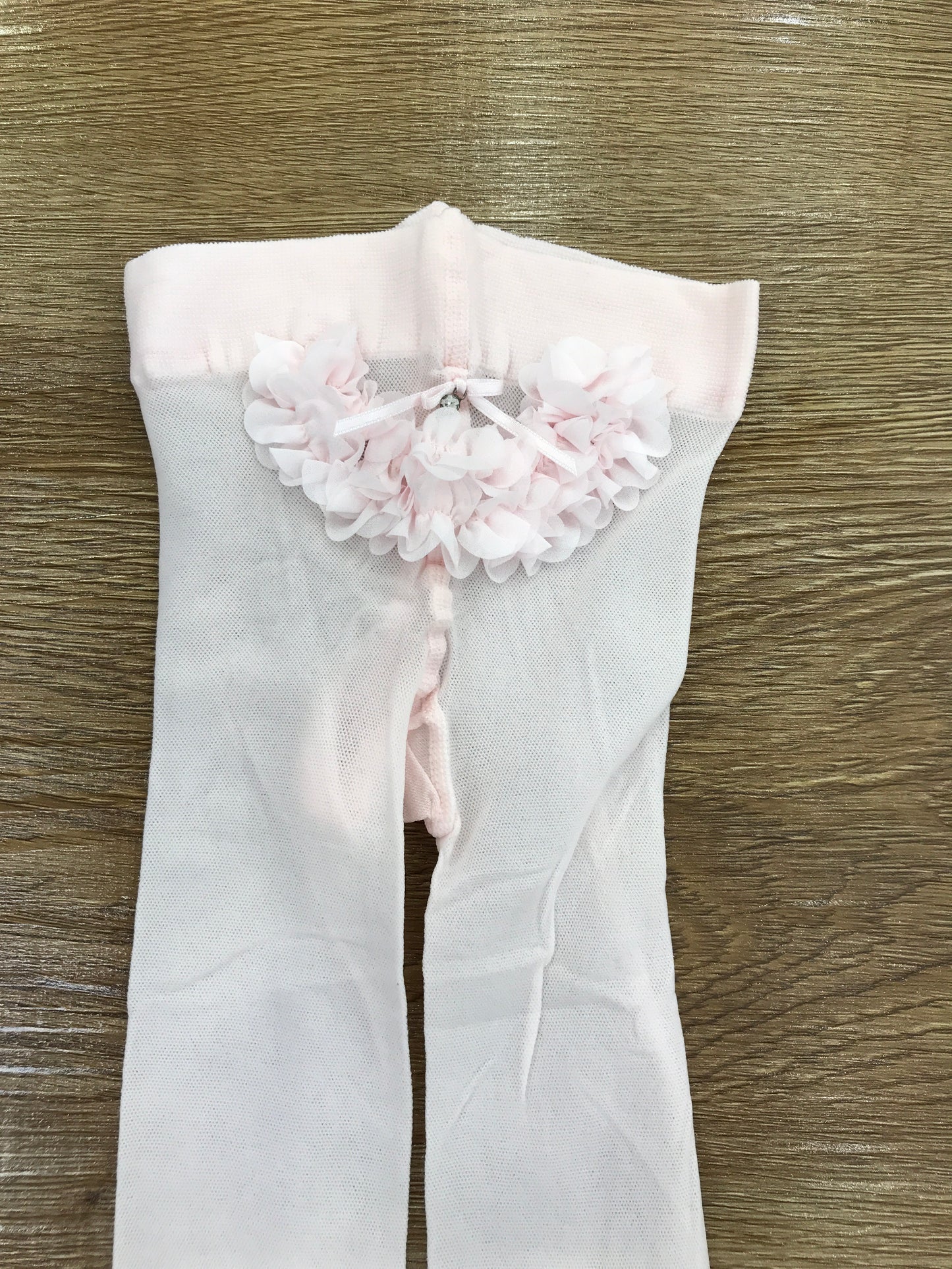 Calze Story Loris in microrete rosa con fiorellini applicati sul retro