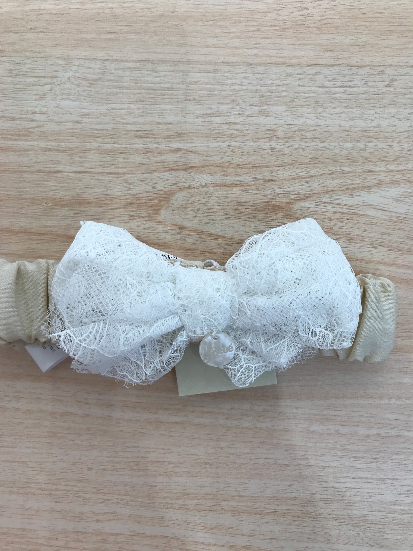 Fascia Le Bebè in cotone con fiocco in pizzo bianco applicato sul davanti