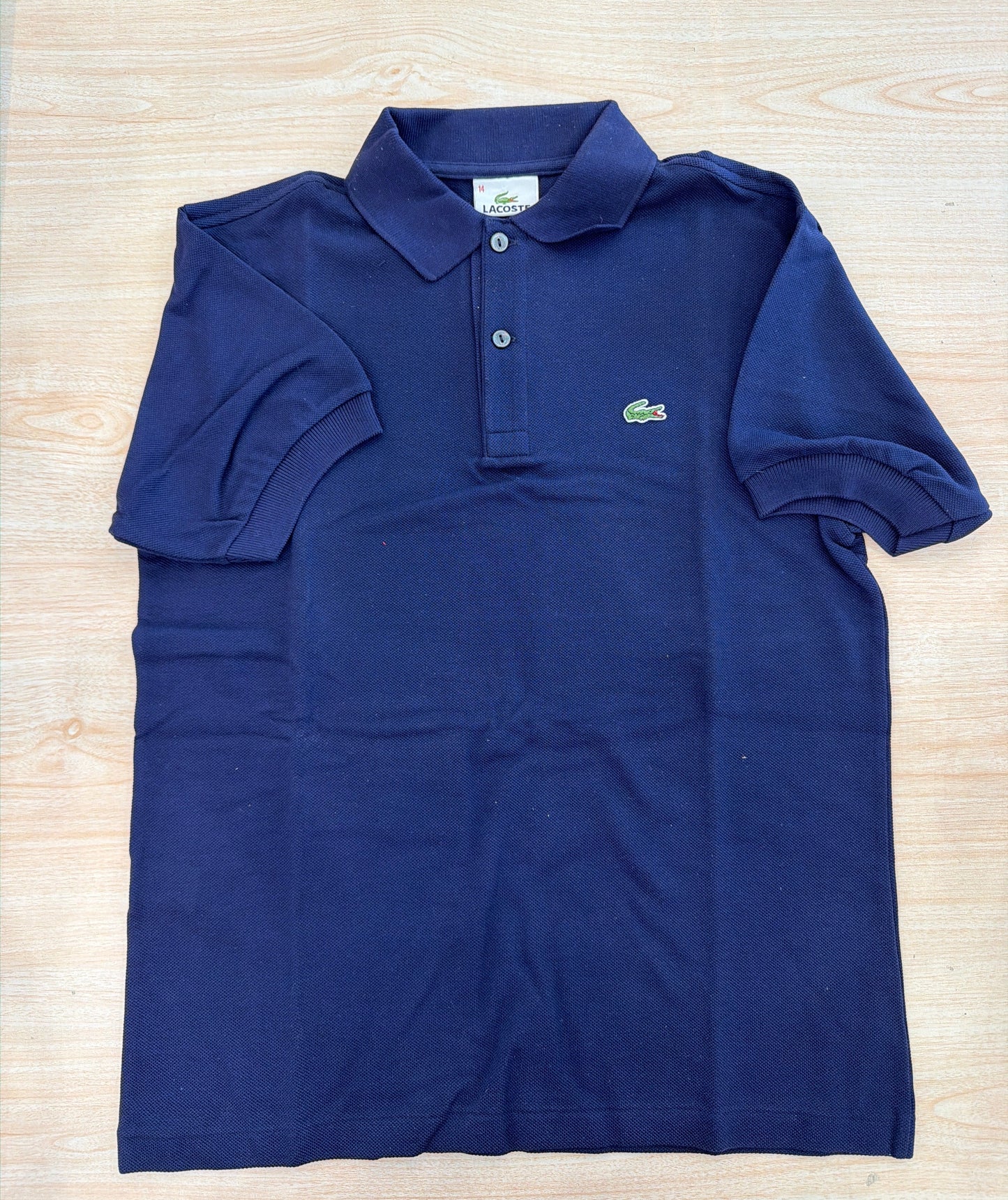 Polo Lacoste in cotone mezza manica con bottoncini e logo ricamato lateralmente unisex