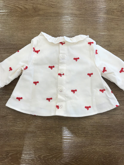 Maglietta Petit Bateau a costine con colletto con rusche con piccoli fiocchetti rossi ricamati