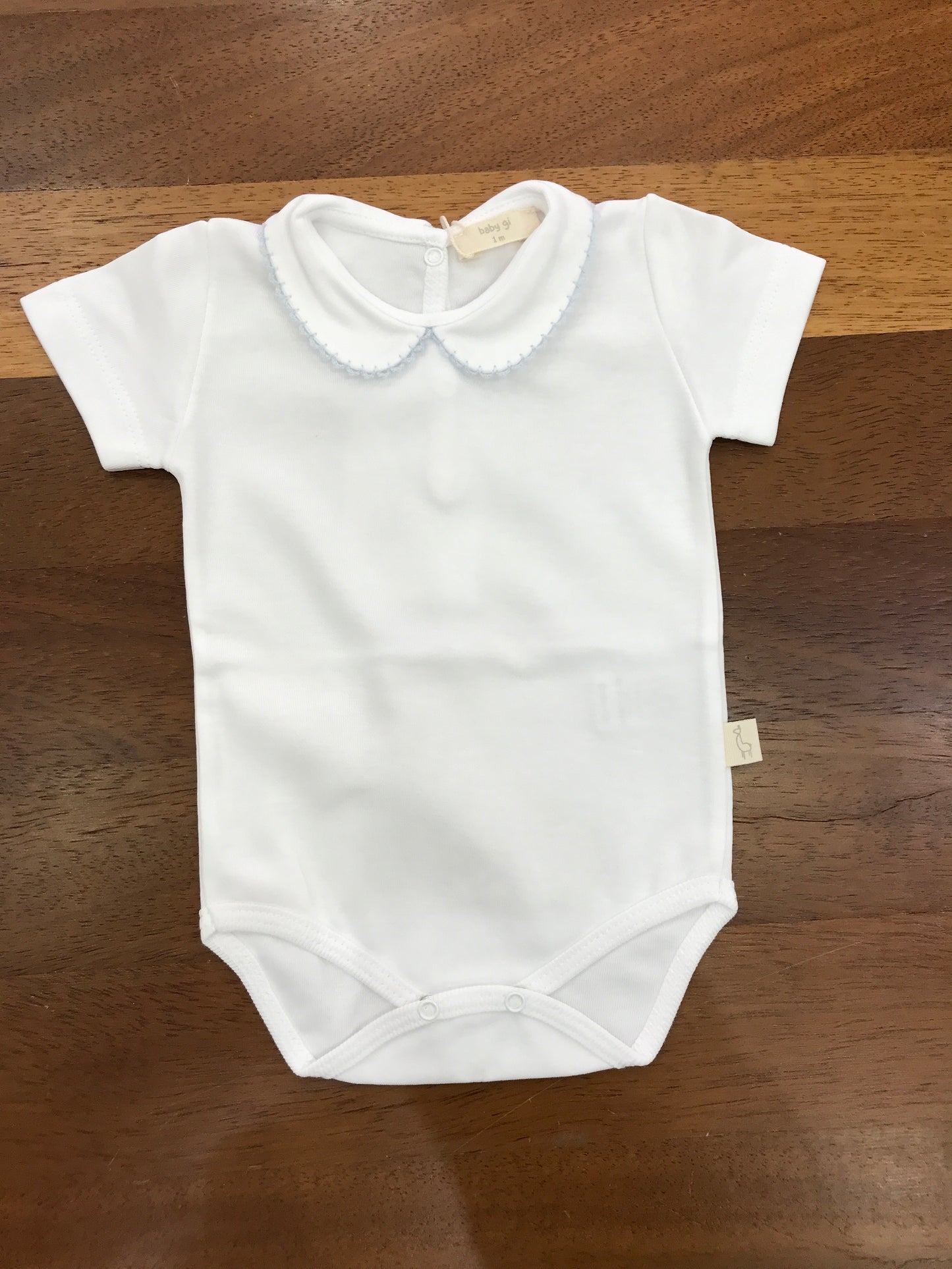 Body Baby Gi in cotone mezza manica con collo tondo rifinito in celeste