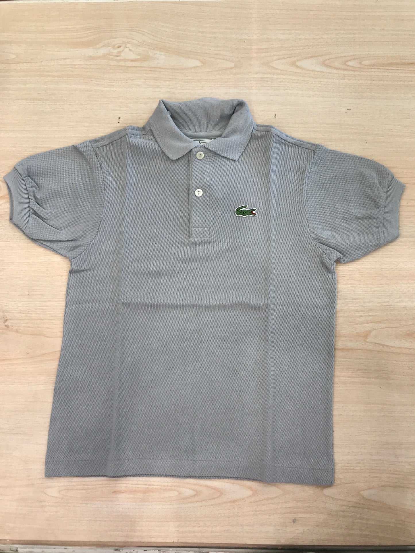 Polo Lacoste in cotone mezza manica con bottoncini e logo ricamato lateralmente unisex