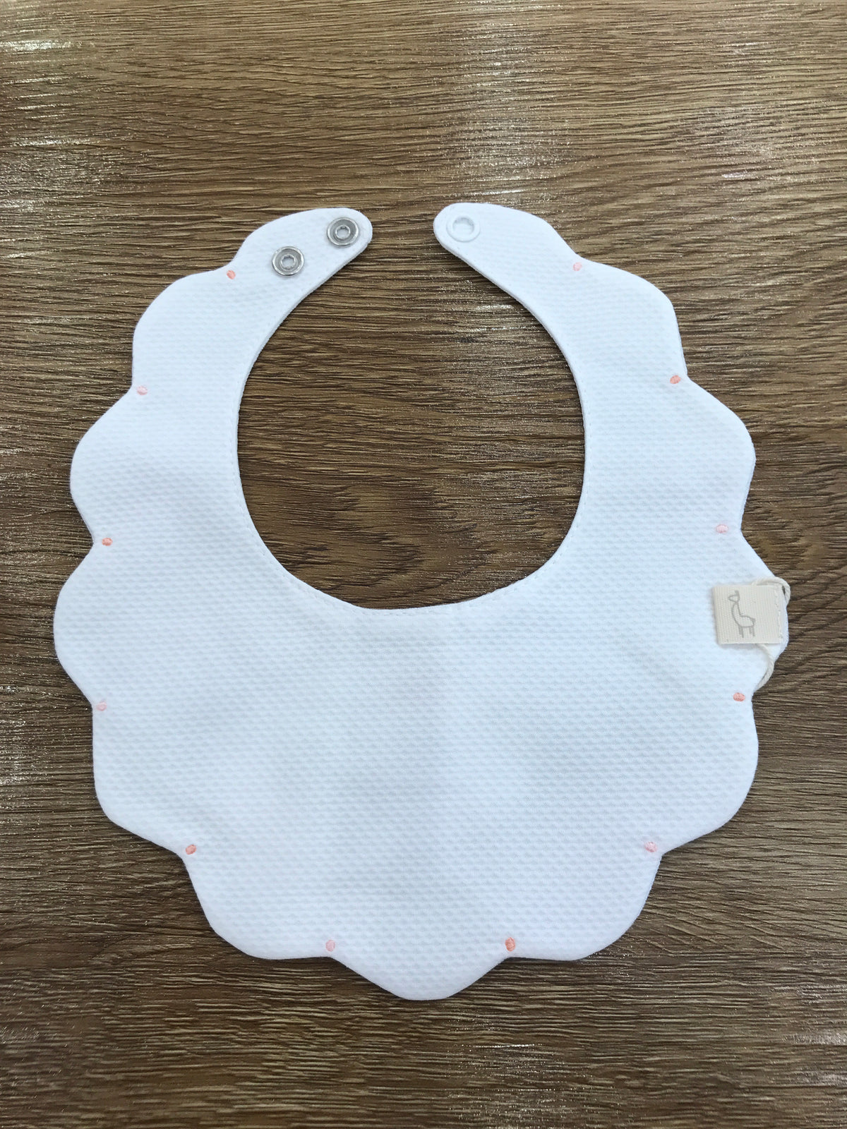 Bavetta Baby Gi in piquet con pois in diverse tonalità di rosa