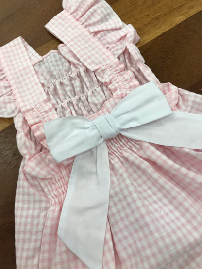 Pagliaccetto Baby Gi in cotone fantasia a quadretti con spalline con rusche con fiocco sul retro