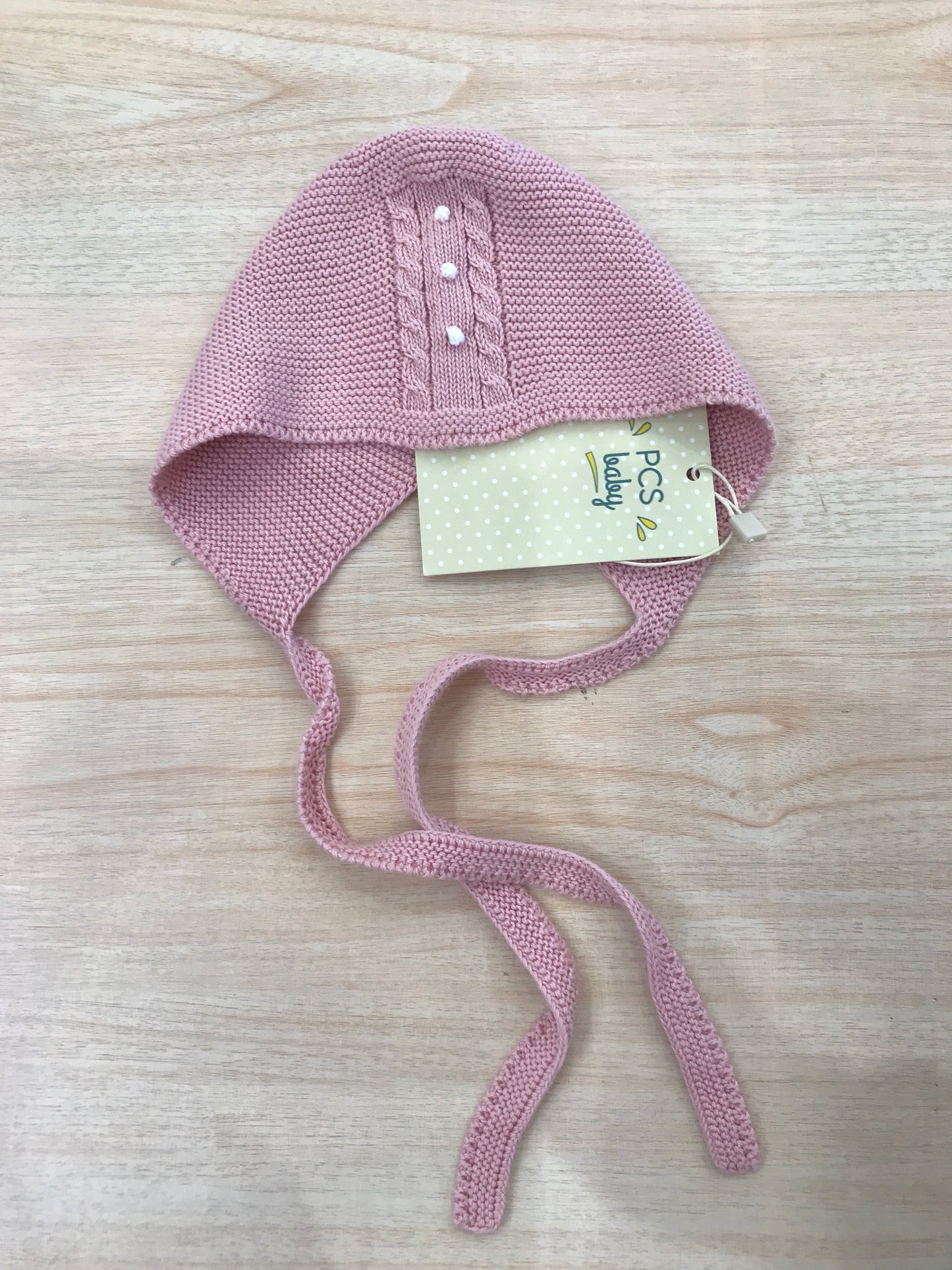 Cuffia PCS in filo rosa con pois in rilievo bianchi e trecce