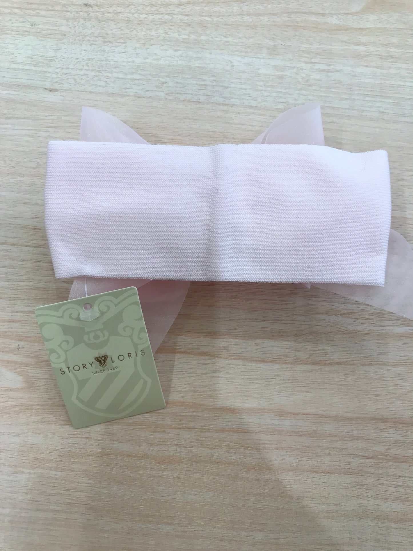 Fascia Story Loris in filo con fiocco grande in rilievo sul davanti
