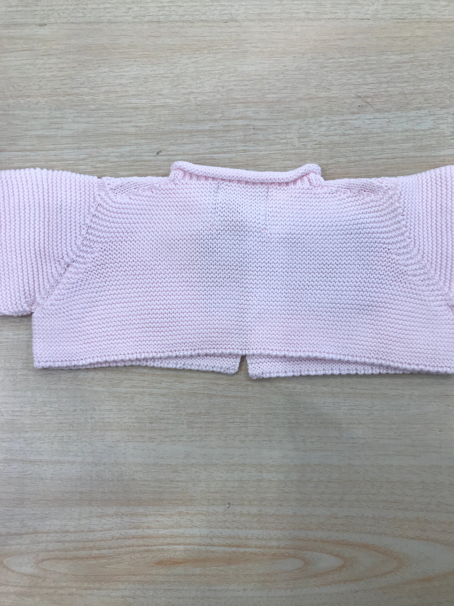 Cardigan Floc Baby in filo rosa accollato con piccolo bottoncini sul davanti