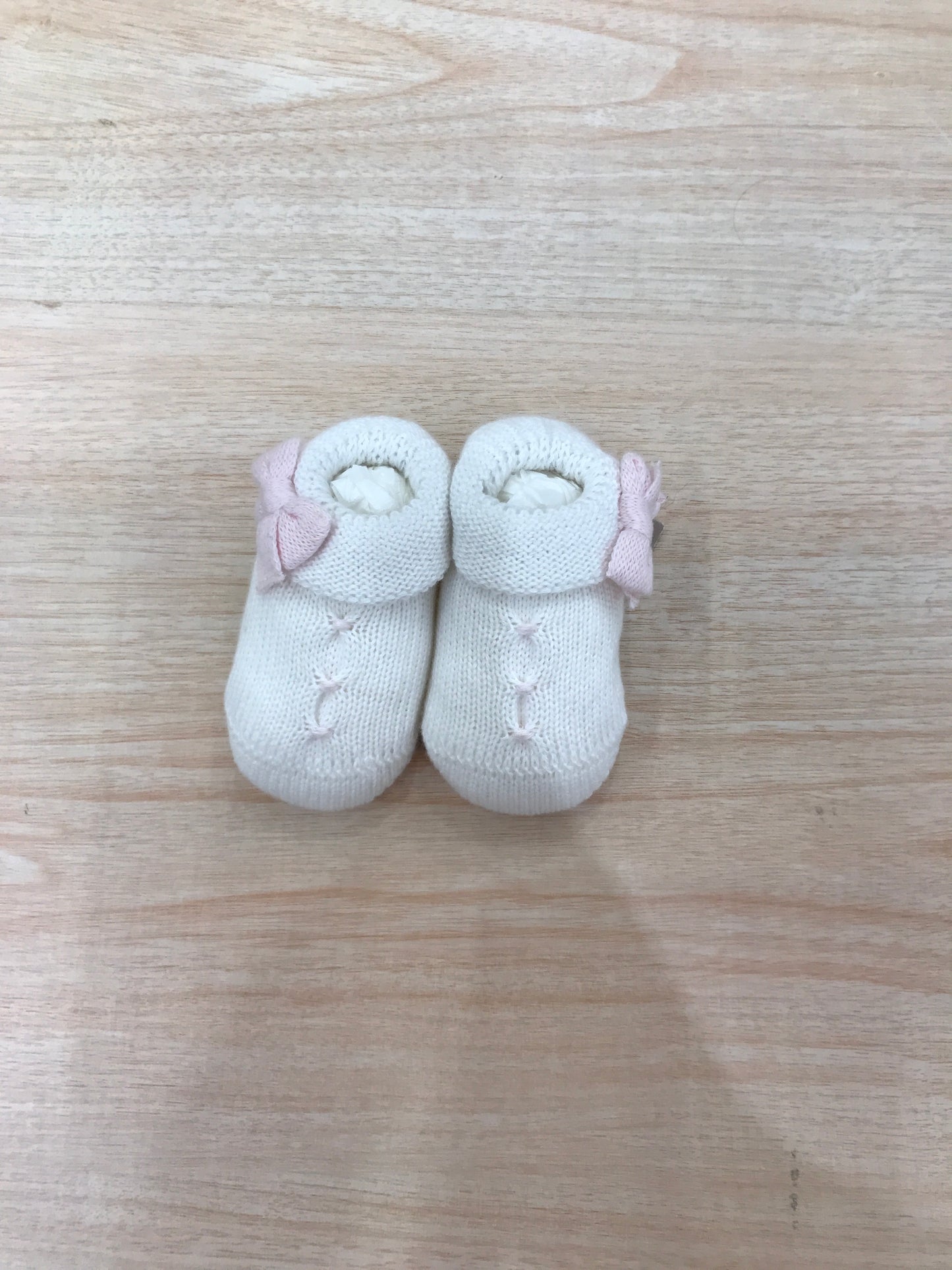 Babbucce Baby Lord in filo bianche con punto smock rosa con fiocchetto laterale