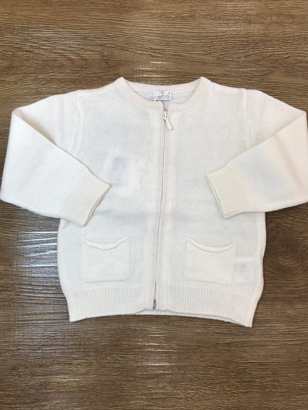 Cardigan Coccodè in lana panna con tasche e zip sul davanti