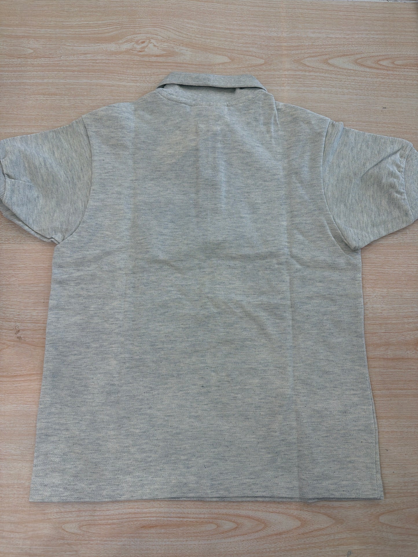 Polo Lacoste in cotone mezza manica con bottoncini e logo ricamato lateralmente unisex