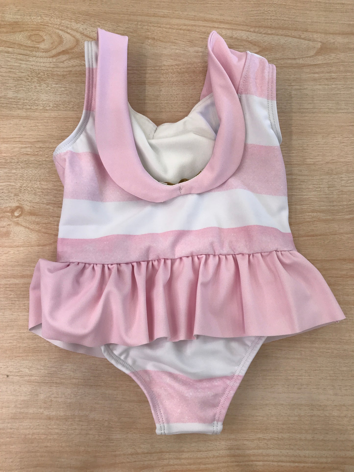 Costume Fofettes intero a righe bianche e rosa con rusche rosa a spallina con fiocco sul davanti