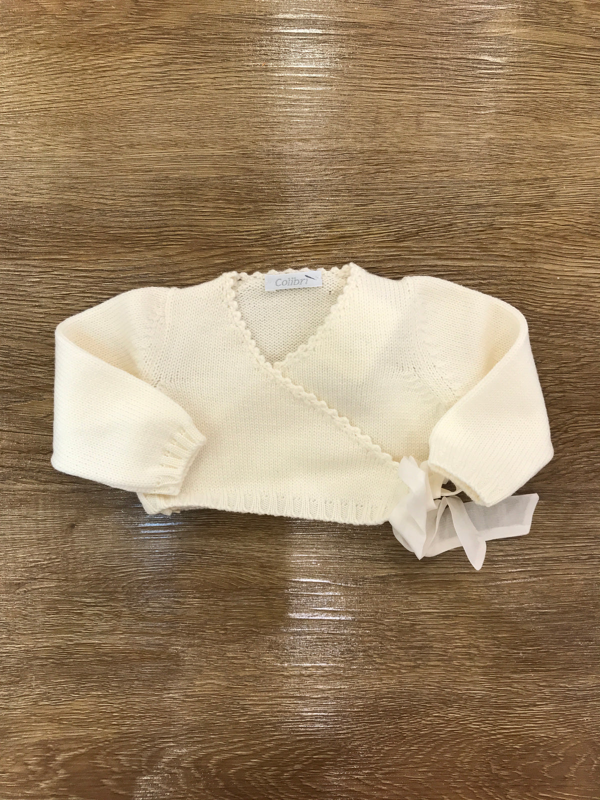 Cardigan Colibrì in lana panna ad incrocio con fiocchetto