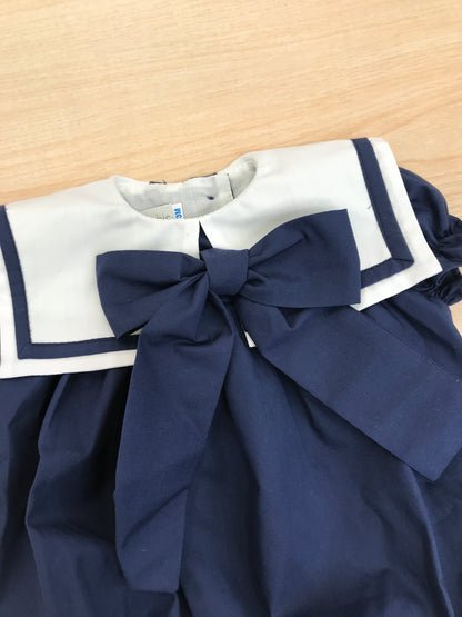 Pagliaccetto Fofettes in cotone mezza manica a sbuffo con collo marinaretto blu e bianco con al centro un fiocco blu