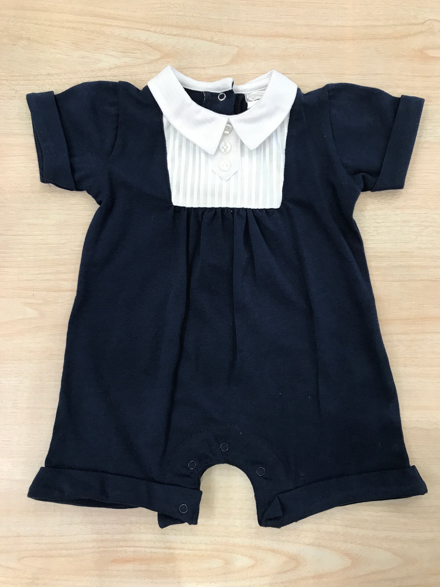 Pagliaccetto Coccodè in cotone blu scuro con dettaglio bianco e colletto a punta