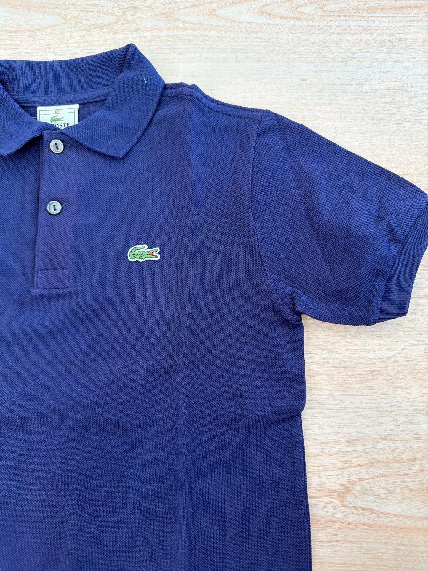 Polo Lacoste in cotone mezza manica con bottoncini e logo ricamato lateralmente unisex