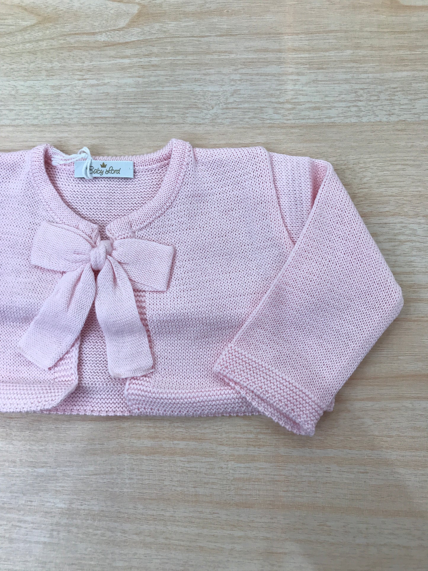 Cardigan Baby Lord in filo rosa manica lunga con fiocchetto sul davanti