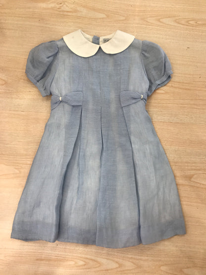 Abito Le Guignol mezza manica a sbuffo dal colore celeste con collo tondo bianco e fiocco sul retro