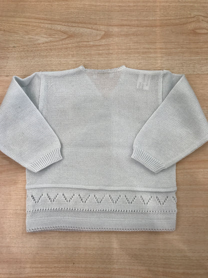 Cardigan Baby Lord in filo celeste chiaro ad incrocio con lavorazioni in basso