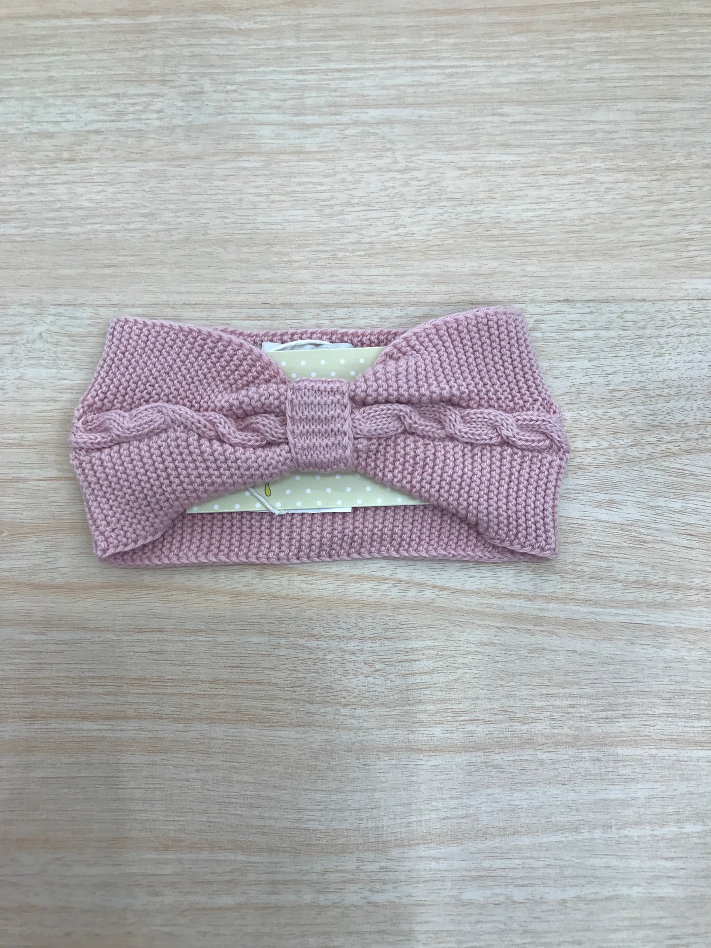Fascia PCS in filo rosa a forma di fiocco con lavorazione di trecce